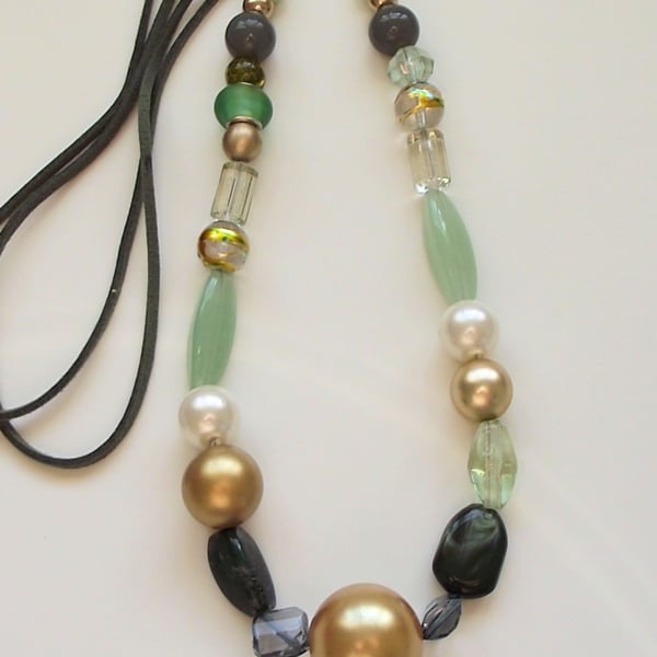 Long green and gold mixed bead necklace
