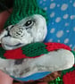 Christmas tree decoration of a Seal, airdry clay with a fabric hat and scarf.   - Image 3