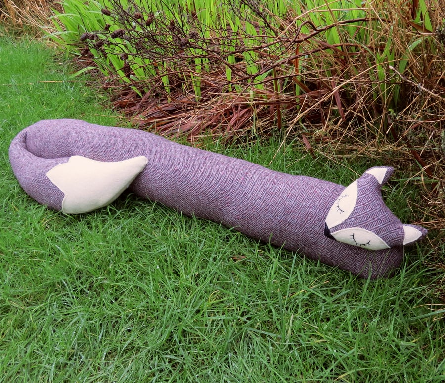 Long fox.  A herringbone wool draught excluder.