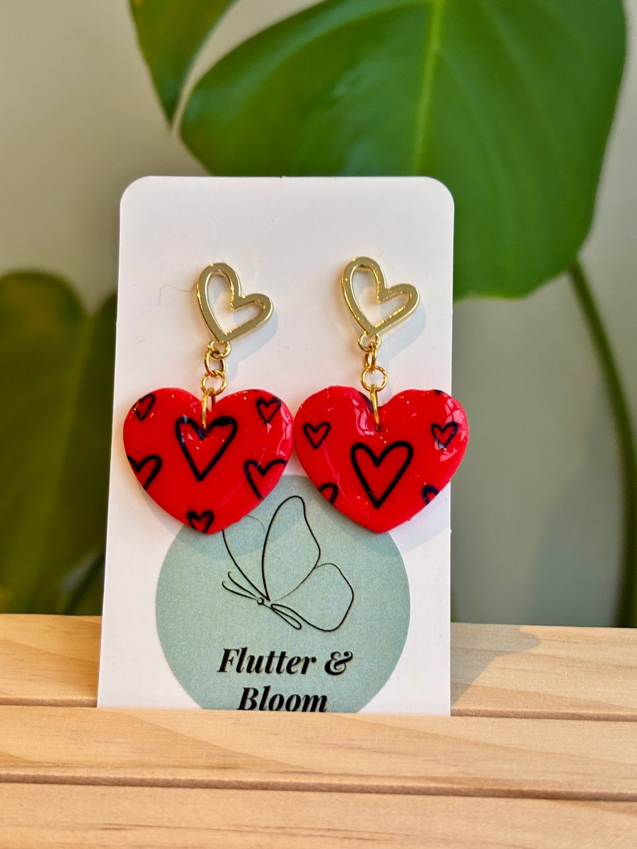 Red and gold love links dangling earrings 
