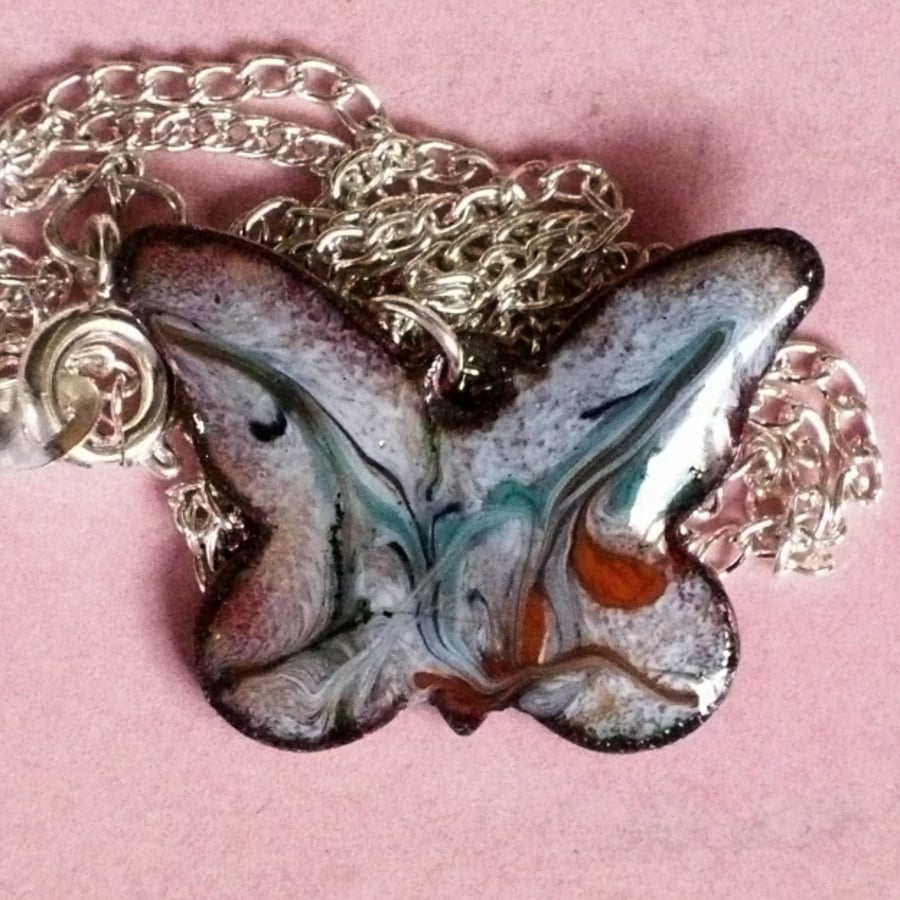 pendant - butterfly scrolled orange, turquoise, dark blue on pale blue