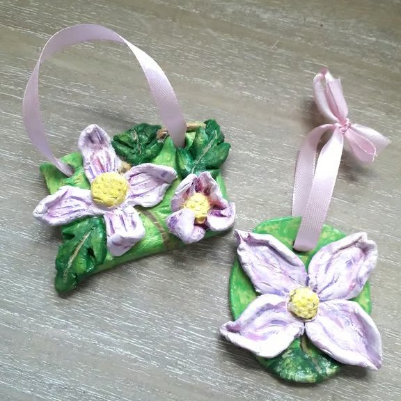 A pair of rustic 'pink clematis" clay hanging sculptures.  
