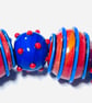 Handmade orange and blue lamp work glass beads