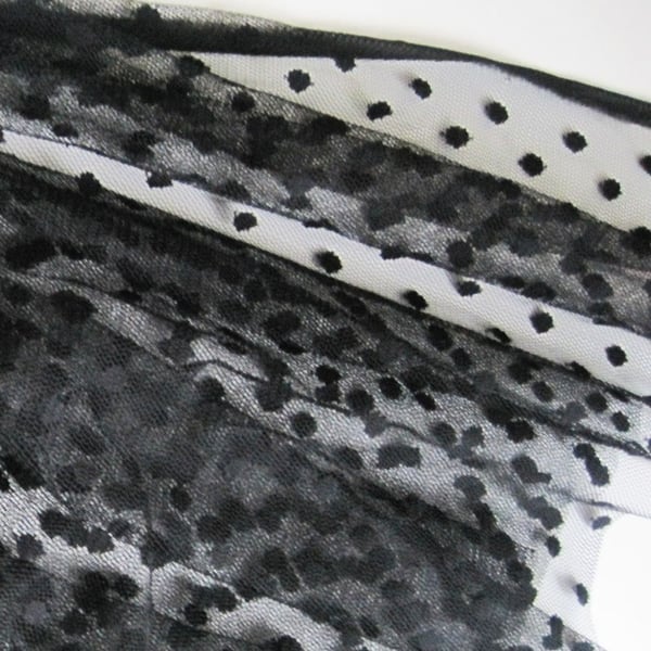Black polka dot tulle fabric
