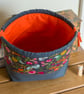 Drawstring project bag made with bright floral print in grey and orange - Image 5