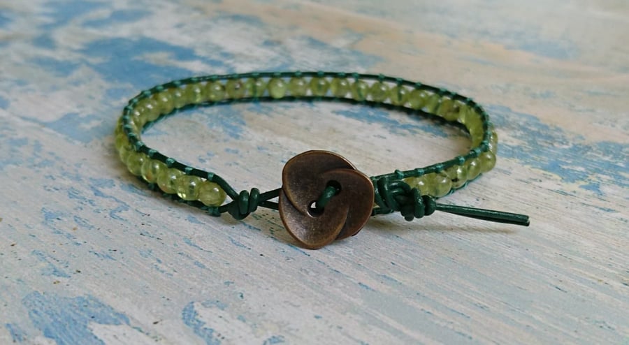 Peridot and leather bracelet with flower button, August semi-precious birthstone