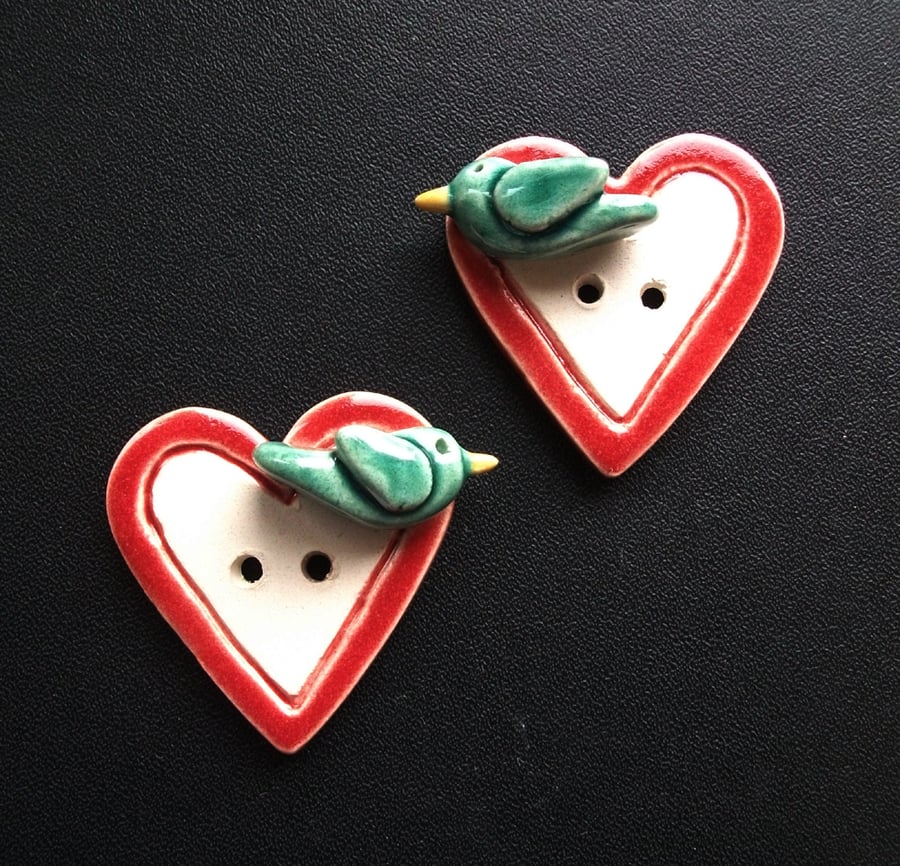 Set of two large ceramic heart buttons with sculpted birds