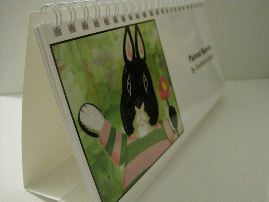 Calendar with prints of bunny rabbit pictures and paintings