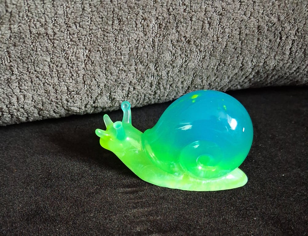 Handmade epoxy resin snail ornament. Glow in the dark!