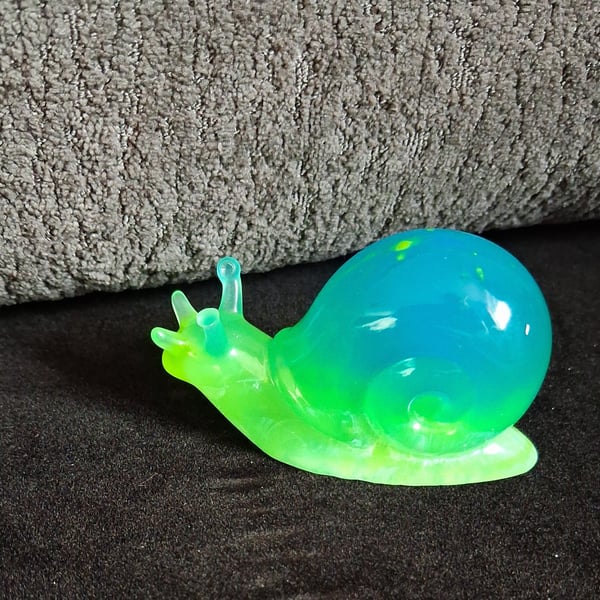 Handmade epoxy resin snail ornament. Glow in the dark!