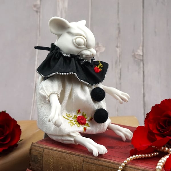 ‘Remy’, a porcelain and textile mouse doll.