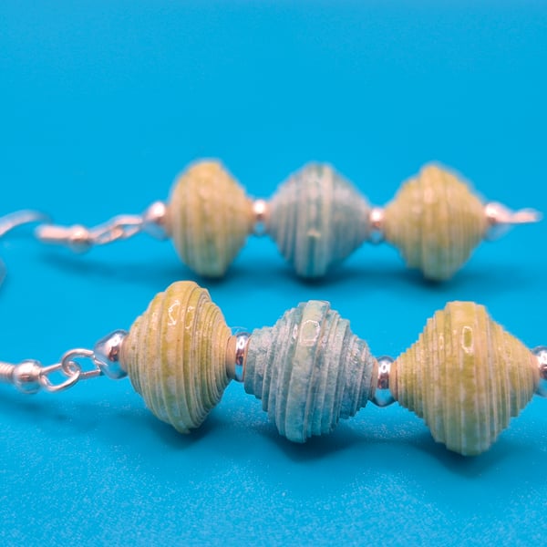 Dangling earring made of 3 pastel beads made from recycled wall paper