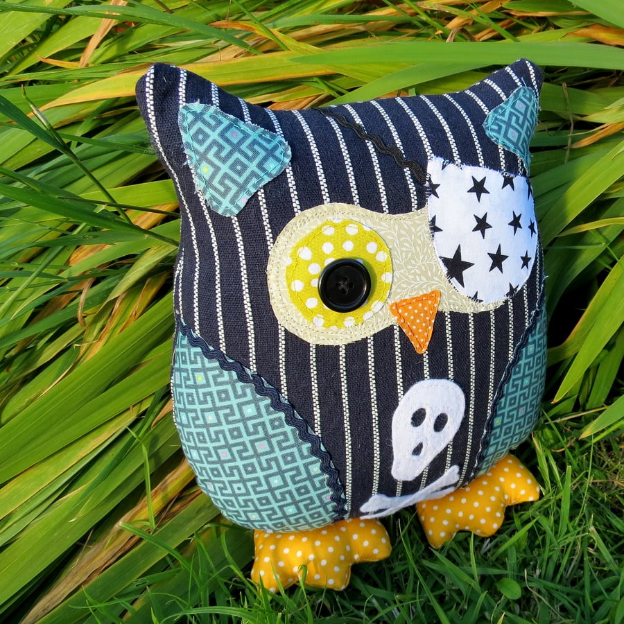 A 24cm tall pirate owl cushion.
