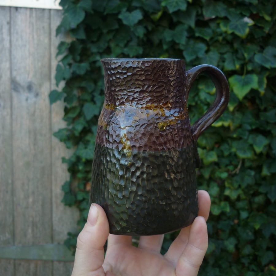 rustic black and crimson small ceramic jug or vase 