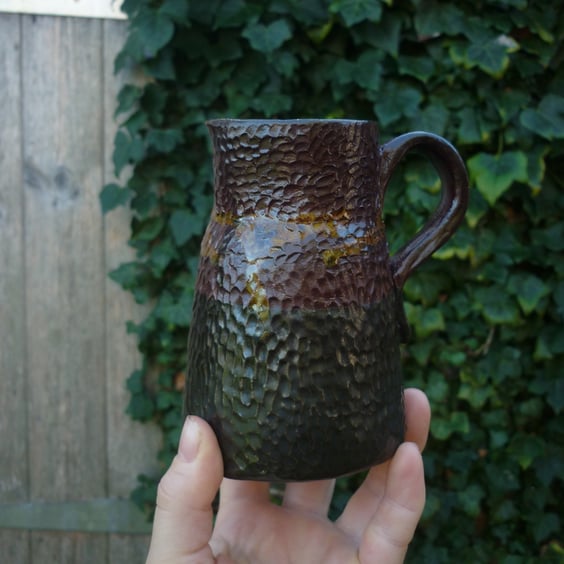 rustic black and crimson small ceramic jug or vase 