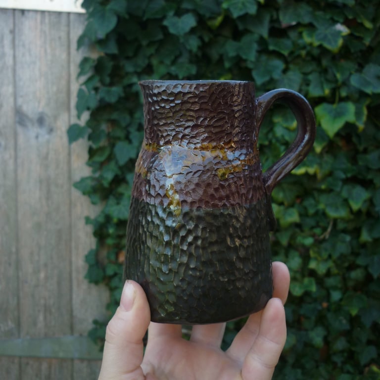 rustic black and crimson small ceramic jug or vase 