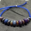 Blue organic spacer adjustable bead slider lampwork bracelet