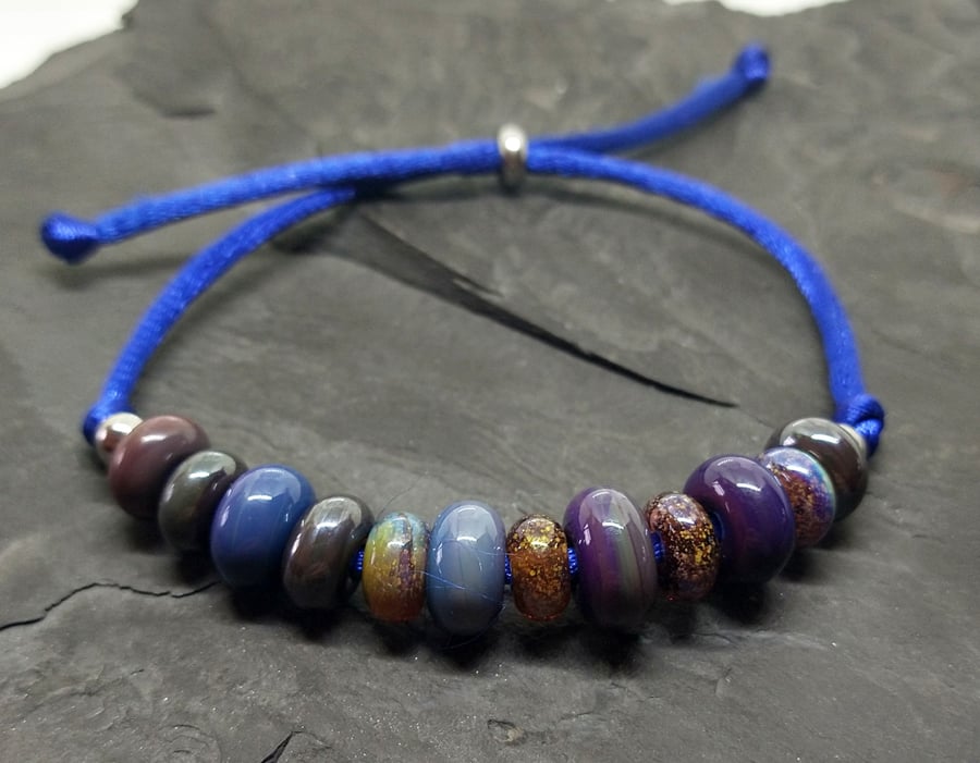 Blue organic spacer adjustable bead slider lampwork bracelet