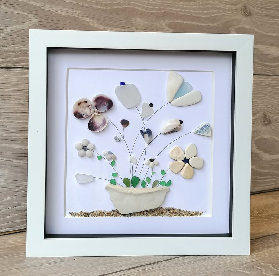 Beachcomb find potted flowers