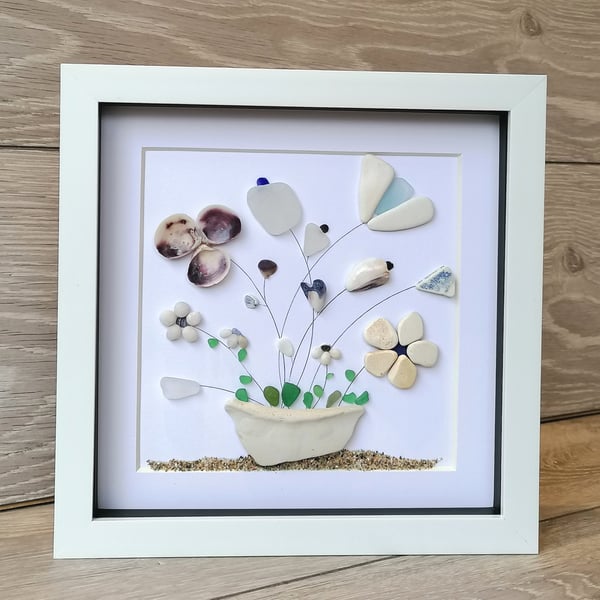 Beachcomb find potted flowers