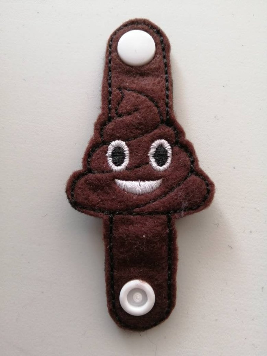 60. Emoji poop cord organiser.