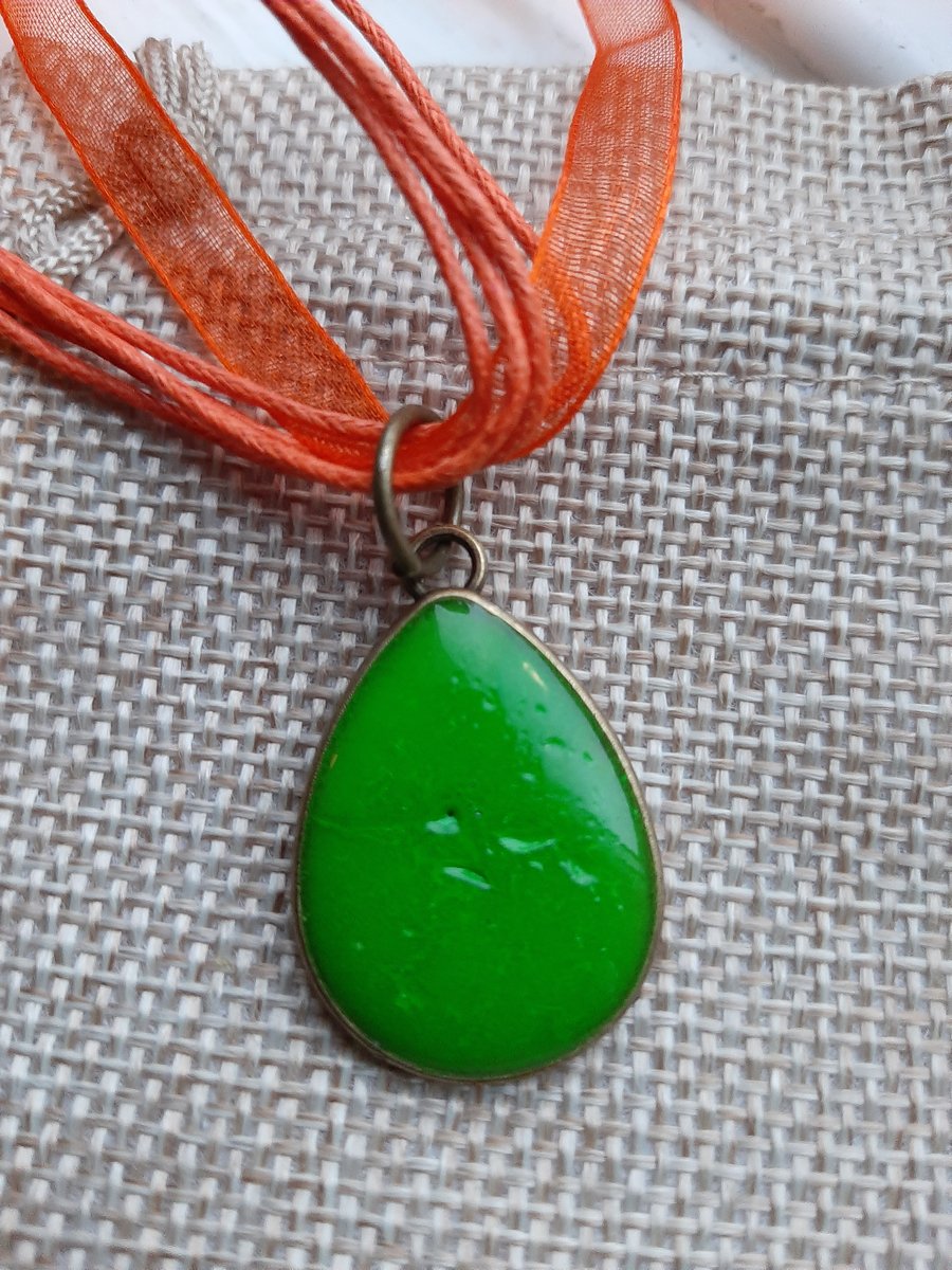 Unique green tear drop crackled  resin pendent with a ribbon necklace