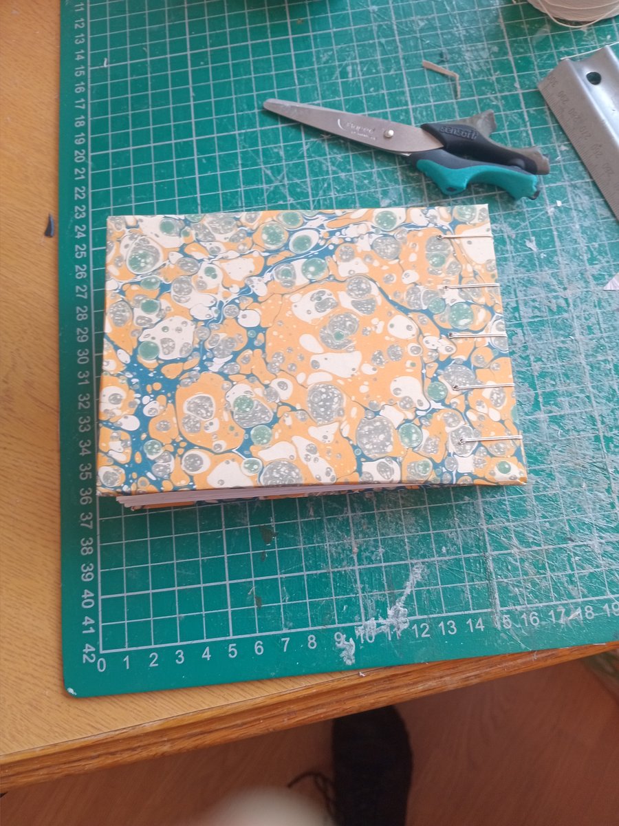 A6 coptic sketchbook with tree free cotton rag watercolour paper.