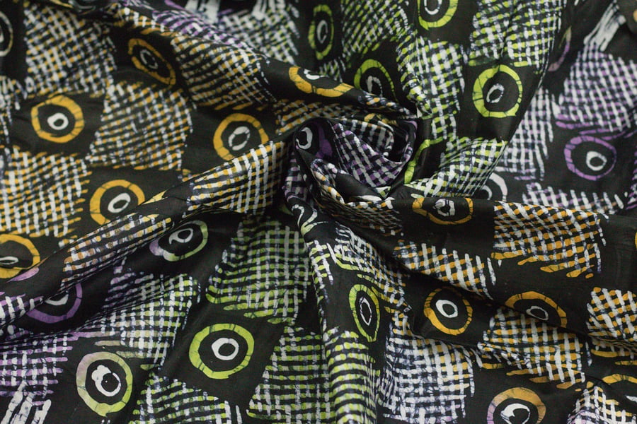 multicoloured dots and circles hand printed African adire batik fabric