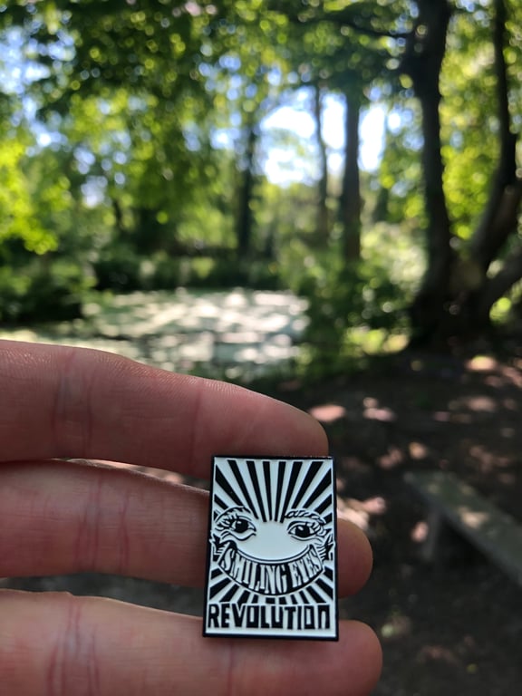 smiling eyes revolution pin, enamel