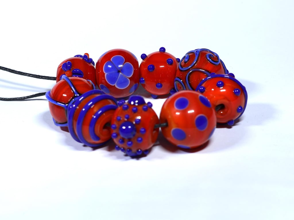 Handmade orange and blue lamp work glass beads