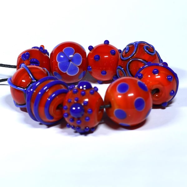 Handmade orange and blue lamp work glass beads