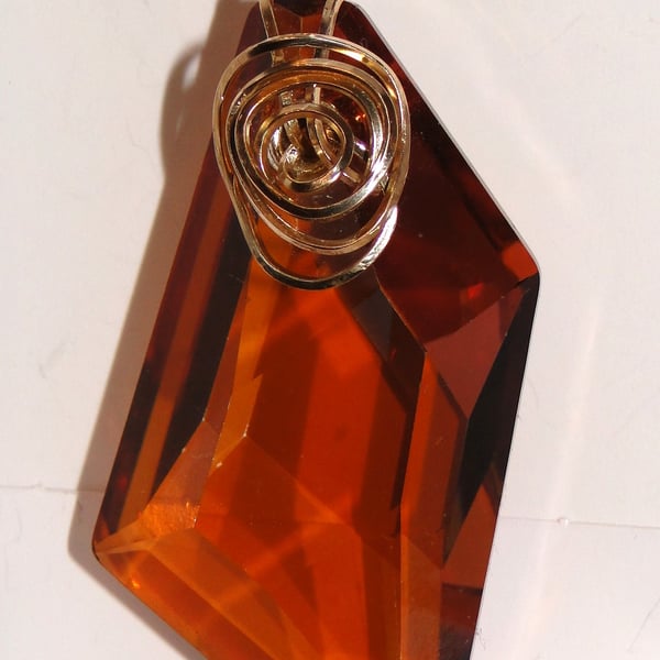 Wire wrapped copper coloured Swarovski Crystal Pendant on a gold chain