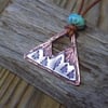 Copper and sterling silver 'mystical mountains' scene ,mixed metal pendant.