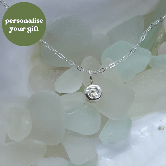 Single silver initial pebble pendant