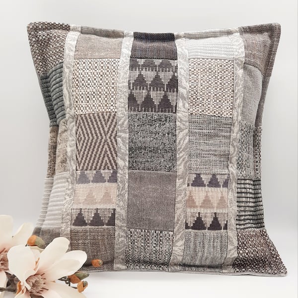 Light grey patchwork cushion cover with envelope back.  