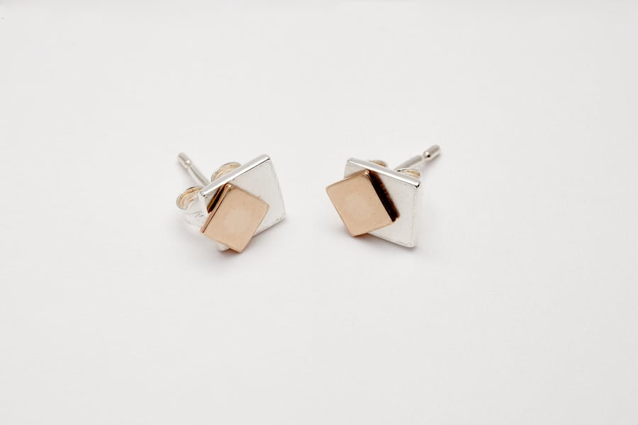 Tana by Fedha - understated movable geometric silver and gold stud earrings
