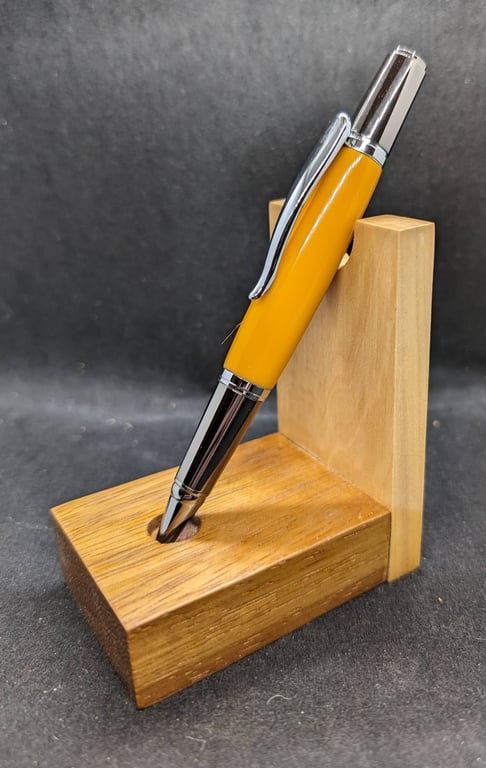 A rollerball pen in vibrant orange