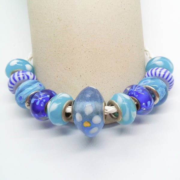 White Plaited Leather Bracelet with Pale Blue Striped Blue Lampwork Beads