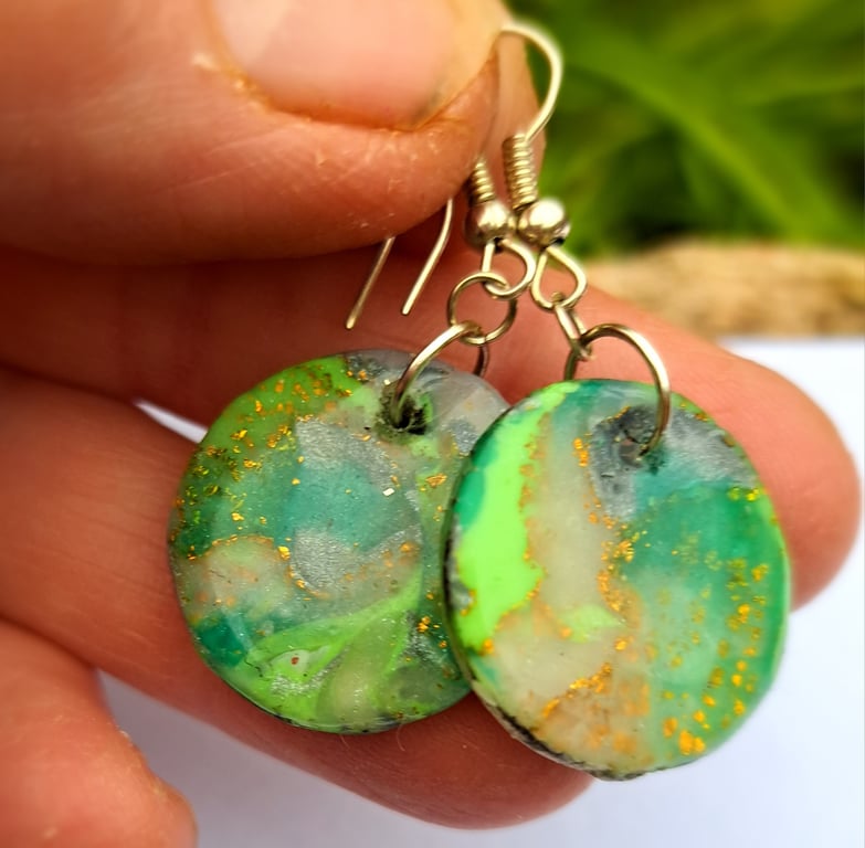 Pair of circular green, white, silver and gold leaf earrings