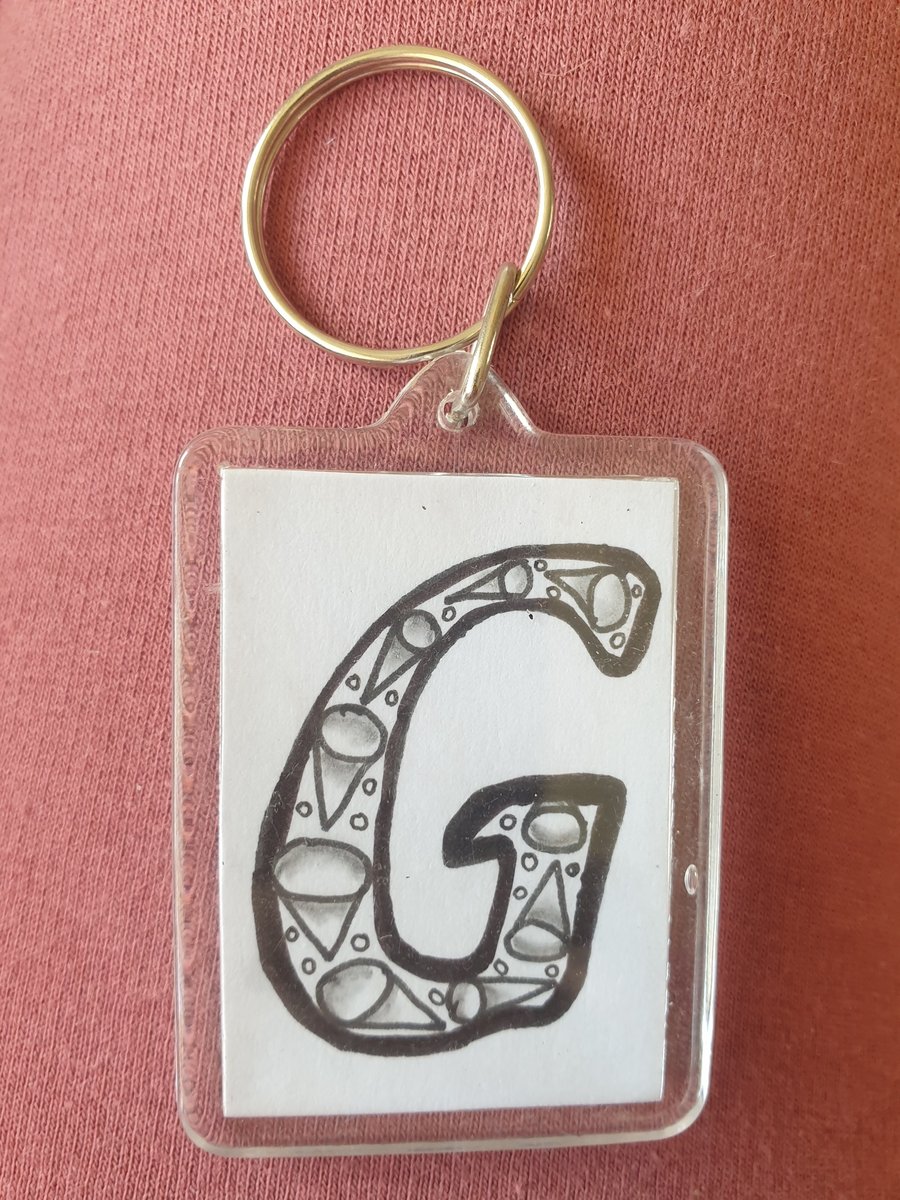 Hand drawn initial "G" keyring.