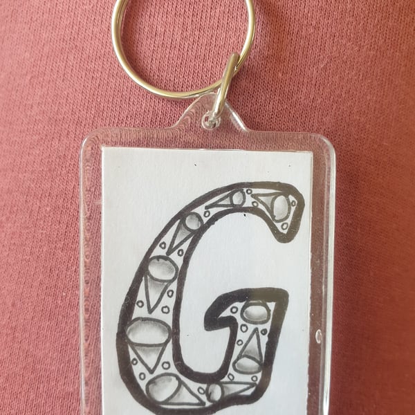 Hand drawn initial "G" keyring.