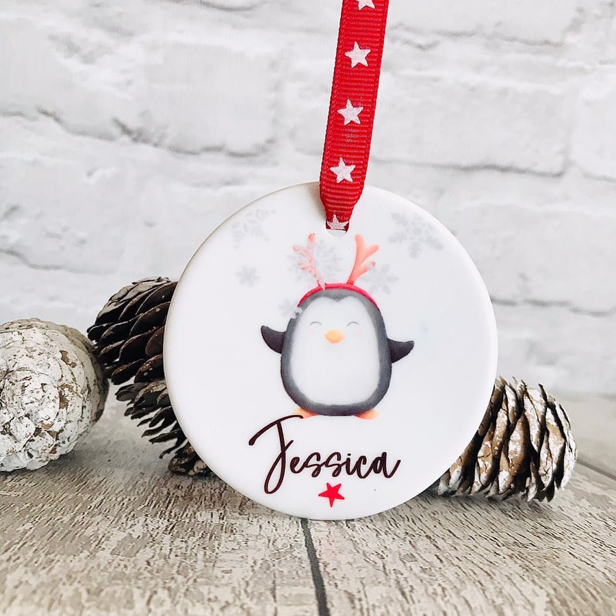 Personalised christmas penguing bauble, ceramic hanging decoration