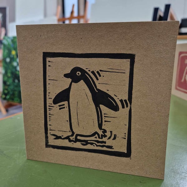 Wiggly penguin 6x6 inch greetings card with envelope. Hand printed lino print.
