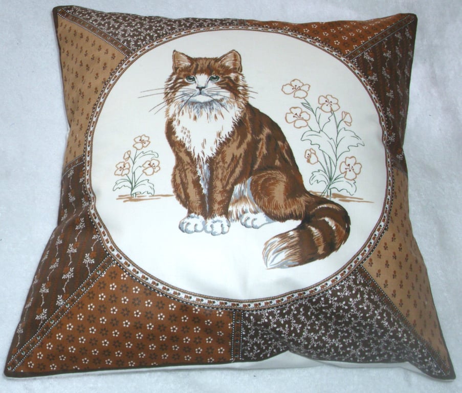 A very pretty brown and white fluffy cat cushion