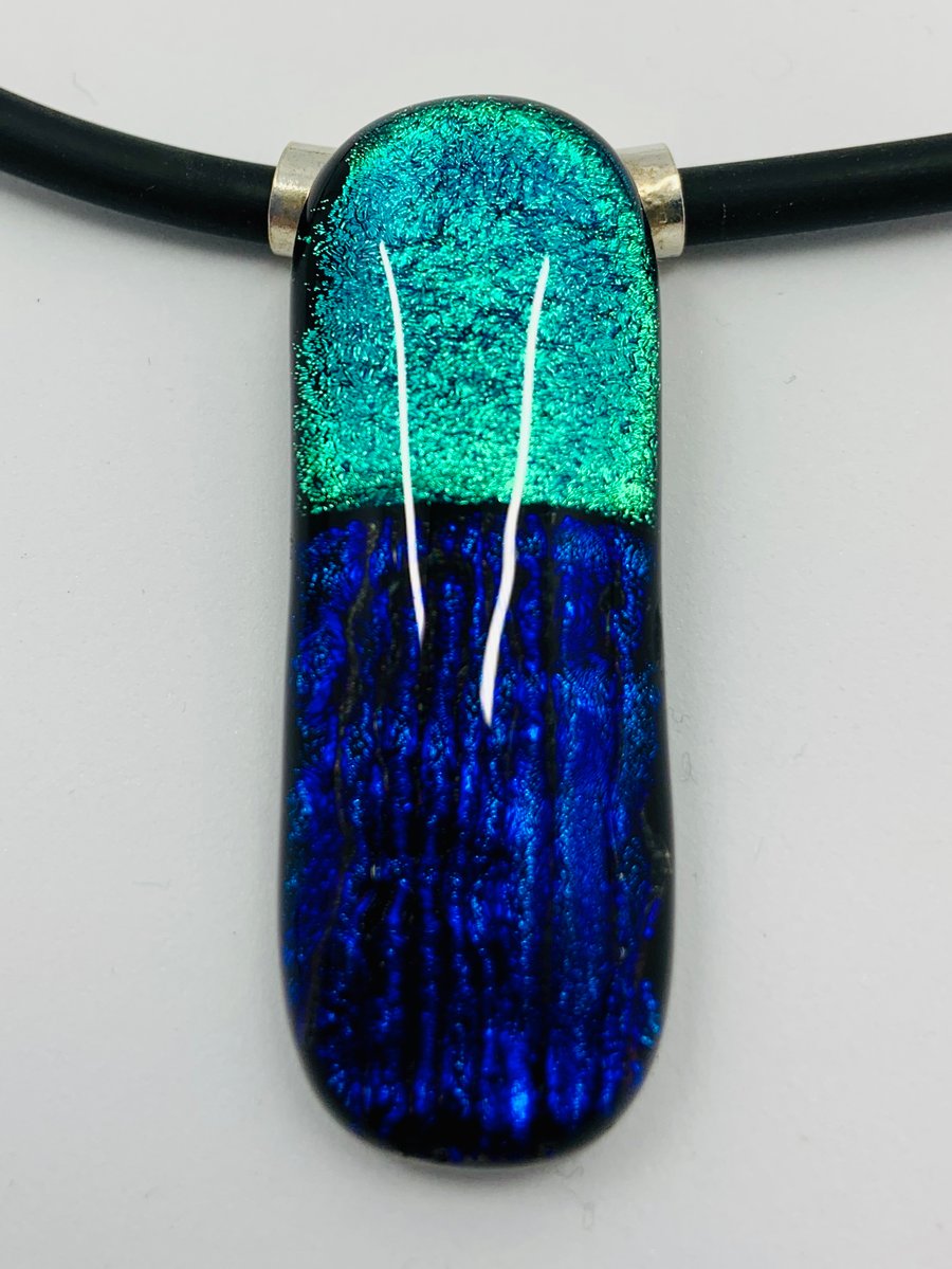 Green and Purple Fused dichroic glass pendant with tube bail and black necklace.