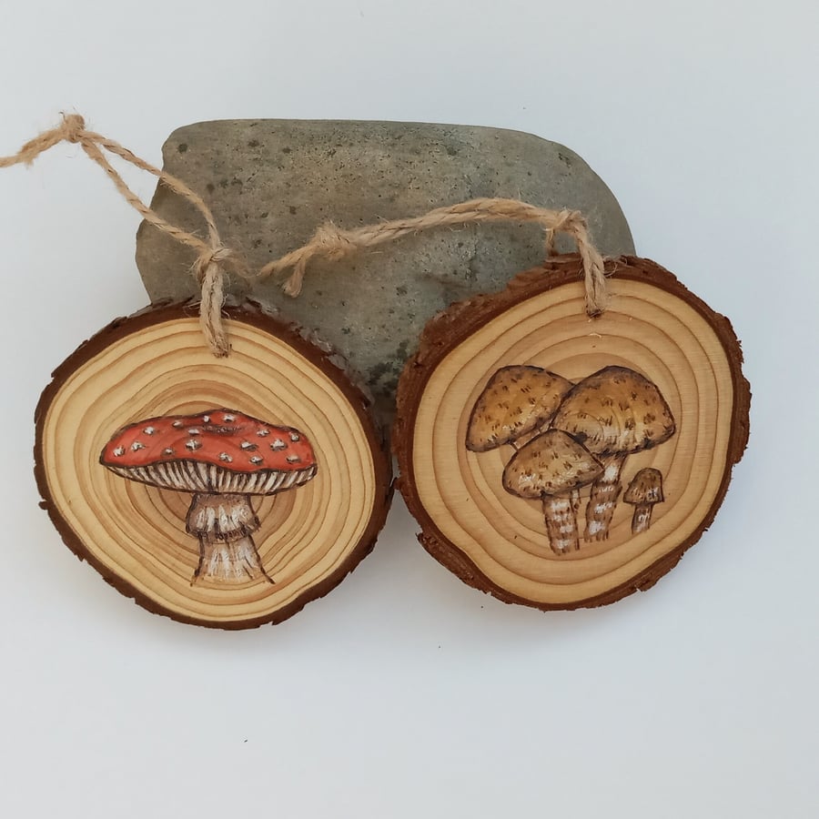 Set of two pyrography and handpainted mushrooms on log slices