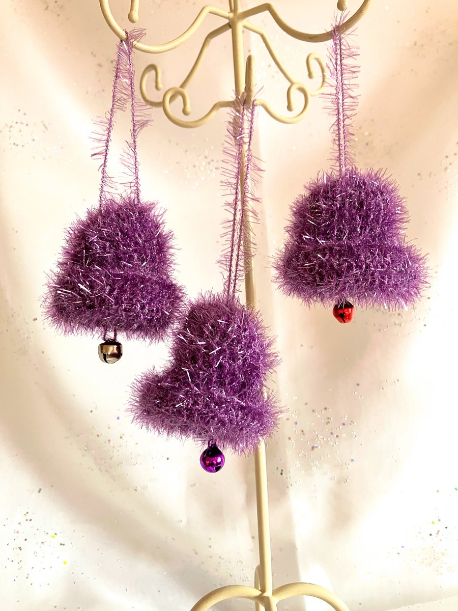 3 purple hand knitted jingle bells
