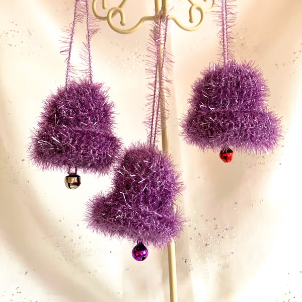 3 purple hand knitted jingle bells