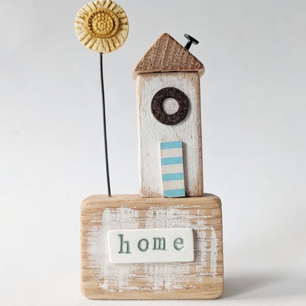 Little Wooden Hut with Clay Sunshine Flower 'Home'