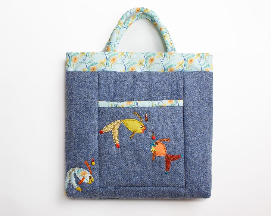 Blue wool bag with front pocket and hand stitched fish